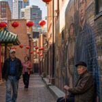 Denver Chinatown alley with red lanterns and heritage mural